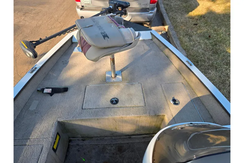 Slide: The Image of 2002 Ranger 116 Cherokee boat deck with seat and trolling motor. - 12