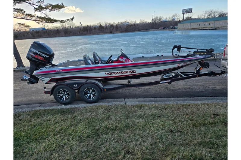 Slide: The Image of 2015 Phoenix 819 Pro boat with Mercury engine, parked by a frozen lake. - 10