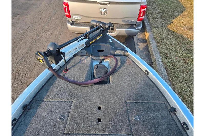 Slide: The Image of 2015 Phoenix 819 Pro boat with Minn Kota trolling motor, parked behind a truck. - 16