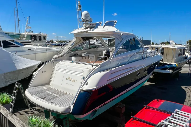 The Image of 2007 Windy Typhoon 43 yacht docked in a marina under clear blue skies. - 0