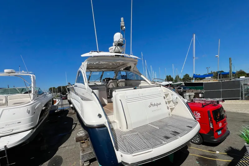 Slide: The Image of 2007 Windy Typhoon 43 yacht docked, showcasing sleek design and spacious deck. - 1