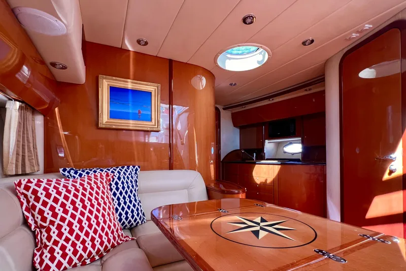 Slide: The Image of Luxurious interior of 2007 Windy Typhoon 43 yacht with elegant seating and wooden accents. - 14