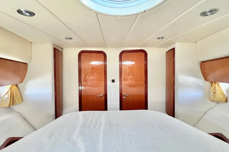 Slide: The Image of Luxurious interior of 2007 Windy Typhoon 43 yacht with elegant seating and wooden finishes. - 16