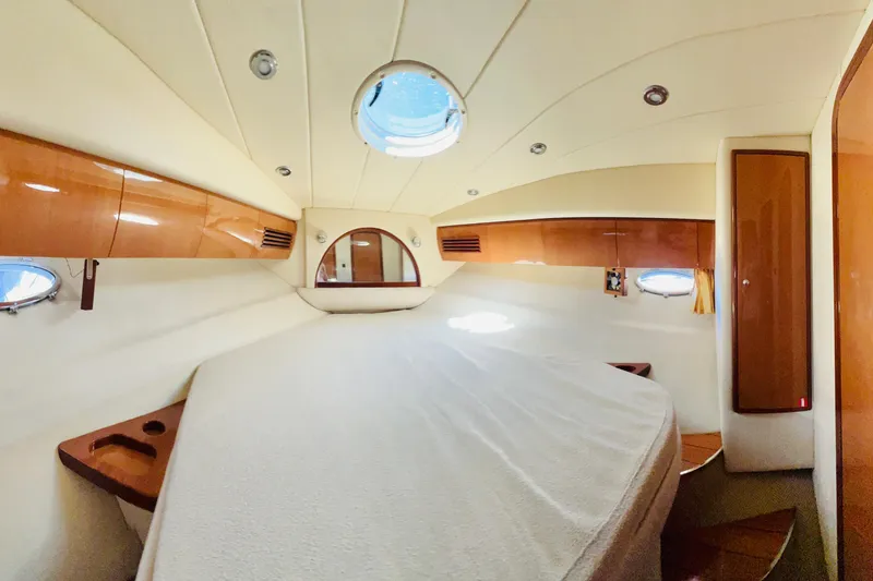 Slide: The Image of Luxurious 2007 Windy Typhoon 43 yacht interior with elegant wood finish and cozy seating area. - 18