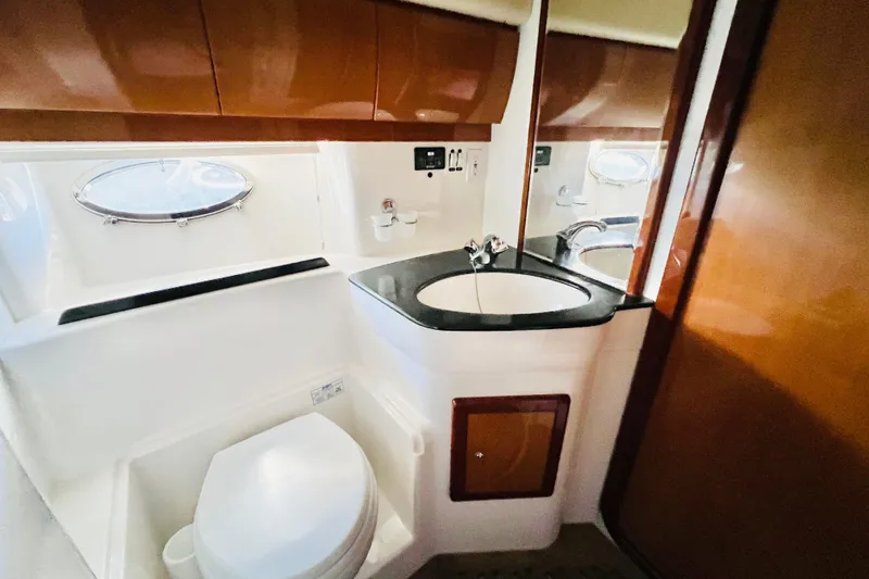Slide: The Image of Luxurious 2007 Windy Typhoon 43 yacht interior with polished wood cabinetry and modern amenities. - 20