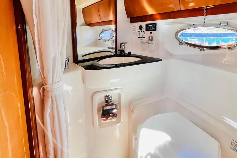 Slide: The Image of Luxurious cabin interior of 2007 Windy Typhoon 43 yacht with wooden doors and ceiling lights. - 21