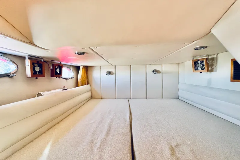 Slide: The Image of Interior cabin of 2007 Windy Typhoon 43 yacht with cozy bedding and portholes. - 24