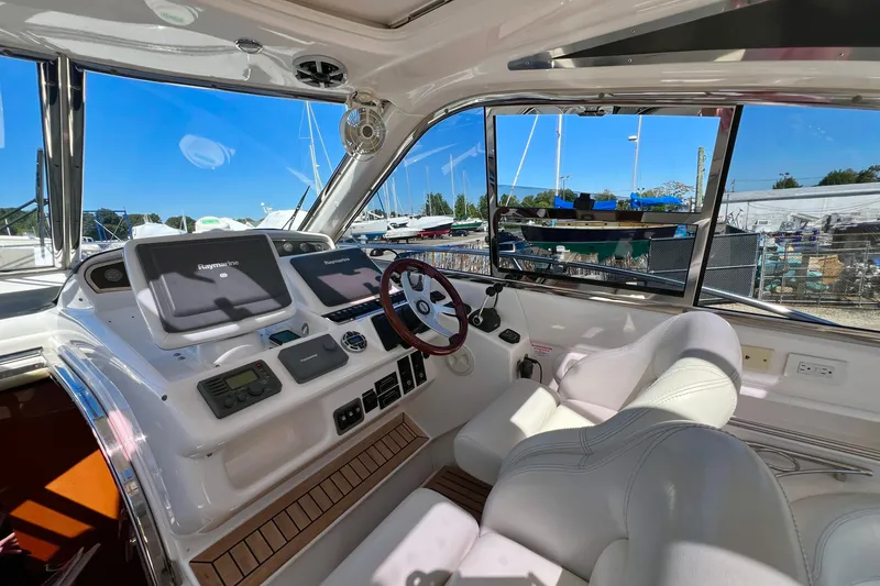 Slide: The Image of Luxury 2007 Windy Typhoon 43 yacht docked, showcasing sleek design and spacious interior. - 6