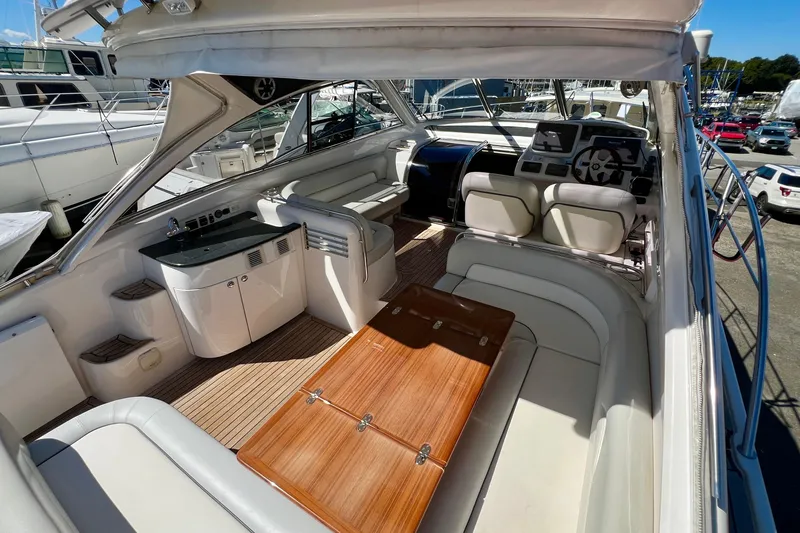 Slide: The Image of 2007 Windy Typhoon 43 yacht interior with wooden deck and cushioned seating. - 7