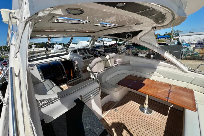 Slide: The Image of Luxurious interior of 2007 Windy Typhoon 43 yacht with elegant seating and wooden table. - 8
