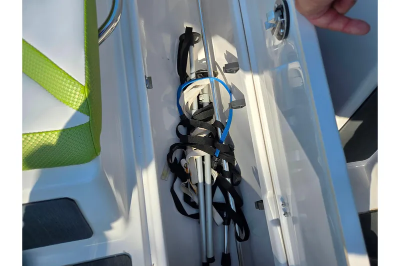 Slide: The Image of Storage compartment in 2015 Scarab 165 H.O. Impulse boat with folded equipment. - 14