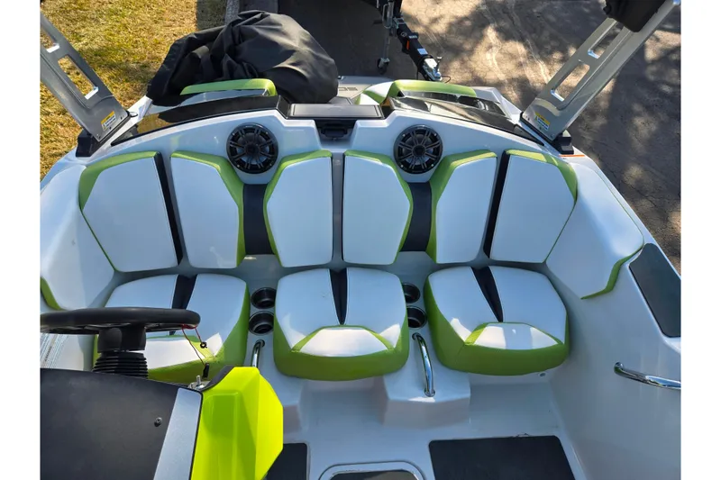 Slide: The Image of 2015 Scarab 165 H.O. Impulse boat interior with green and white seating. - 17