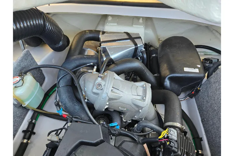 Slide: The Image of Engine compartment of a 2015 Scarab 165 H.O. Impulse boat, showcasing mechanical components. - 19