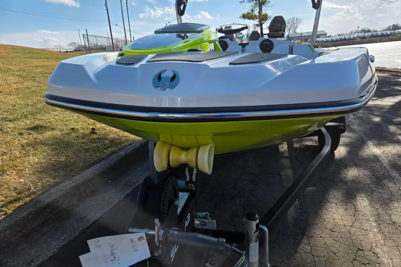 Slide: The Image of 2015 Scarab 165 H.O. Impulse boat on trailer, vibrant green and white design. - 6