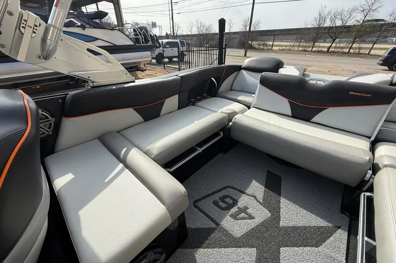 Slide: The Image of 2017 MasterCraft X46 boat interior with sleek seating and modern design. - 11