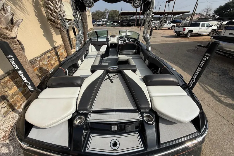 Slide: The Image of 2017 MasterCraft X46 boat interior with sleek seating and modern design. - 7