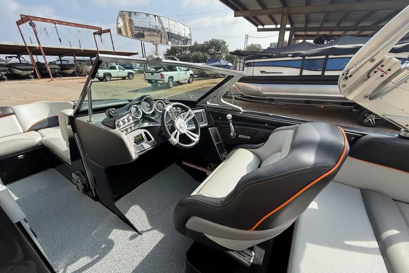 Slide: The Image of 2017 MasterCraft X46 boat interior with modern dashboard and comfortable seating. - 9
