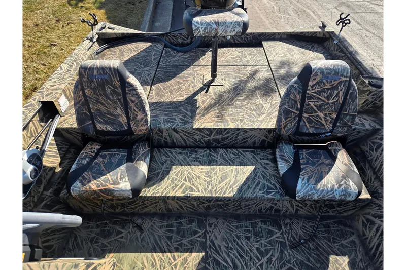 Slide: The Image of 2020 Lowe Roughneck 2070SC boat with camouflage seating and deck, ideal for outdoor adventures. - 21