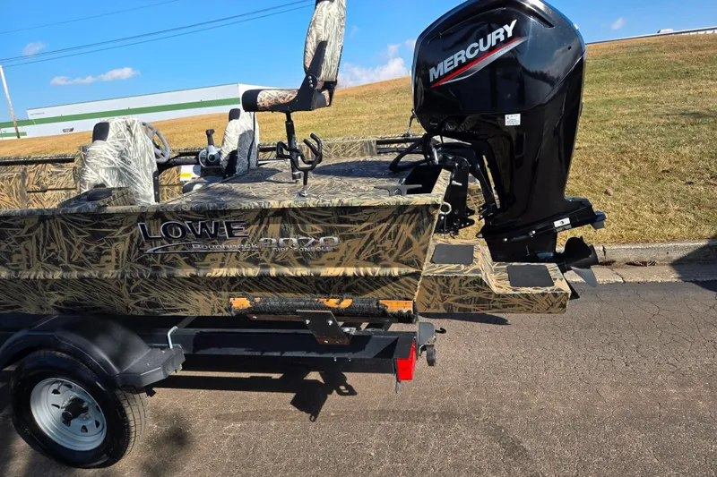 Slide: The Image of 2020 Lowe Roughneck 2070SC boat with Mercury engine on a trailer. - 4