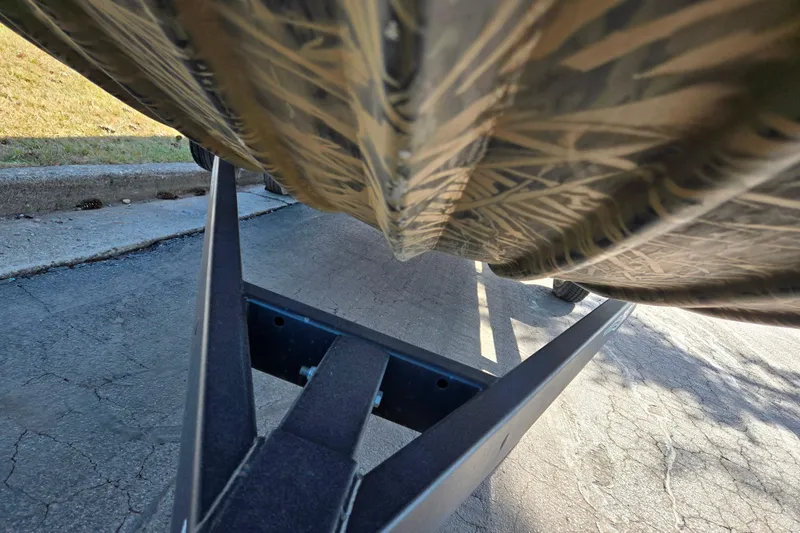 Slide: The Image of 2020 Lowe Roughneck 2070SC boat hull on trailer, close-up view. - 8