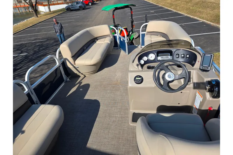 Slide: The Image of 2021 Sun Tracker Party Barge 18 DLX interior with seating and control panel. - 17