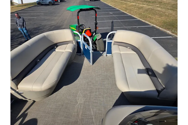 Slide: The Image of 2021 Sun Tracker Party Barge 18 DLX with spacious seating in a parking lot. - 20