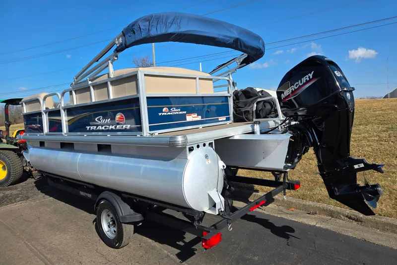 Slide: The Image of 2021 Sun Tracker Party Barge 18 DLX pontoon boat with Mercury engine on trailer. - 3