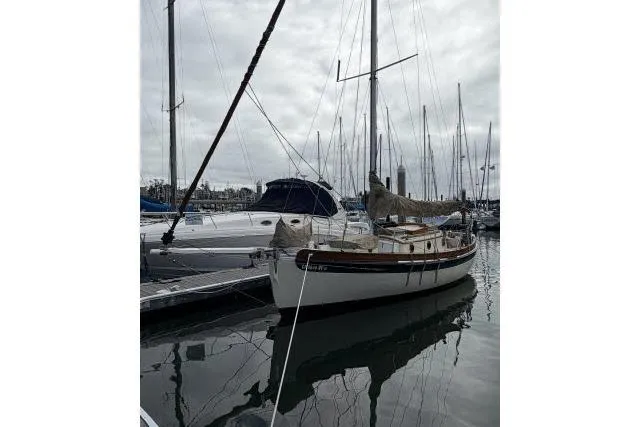 Slide: The Image of Sailboat docked in marina, Bristol Channel Cutter 28, 1997 model. - 12