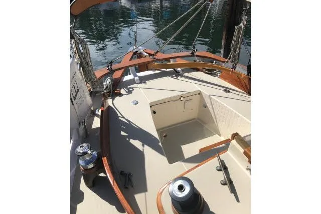 Slide: The Image of 1997 Bristol Channel Cutter 28 sailboat deck with wooden trim and winches. - 4