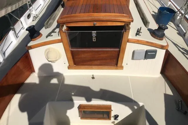 Slide: The Image of Cockpit of 1997 Bristol Channel Cutter 28 sailboat with wooden hatch and winches. - 6