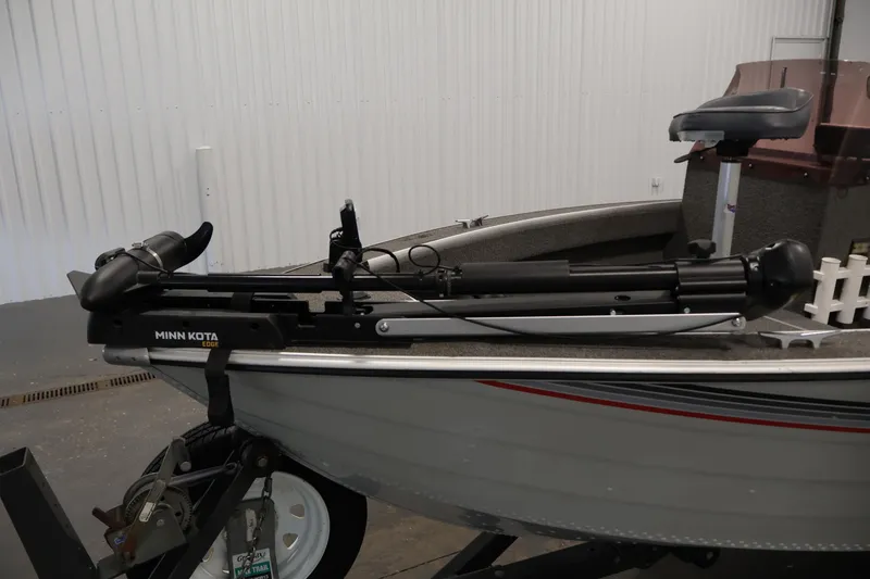 Slide: The Image of 1990 Lowe 1620V boat with Minn Kota Edge trolling motor in a garage setting. - 11