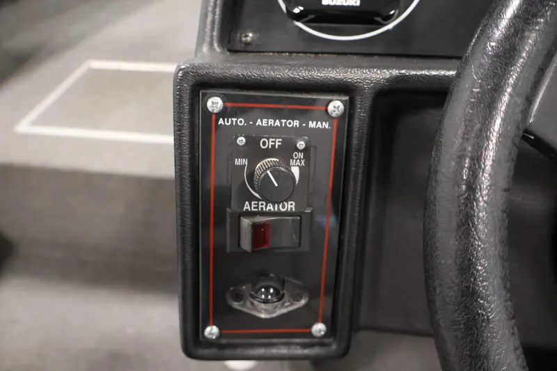 Slide: The Image of Control panel of a 1990 Lowe 1620V boat featuring aerator settings. - 26
