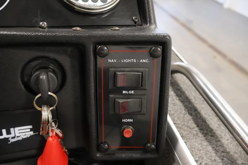 Slide: The Image of Control panel of a 1990 Lowe 1620V boat with bilge and horn switches. - 27