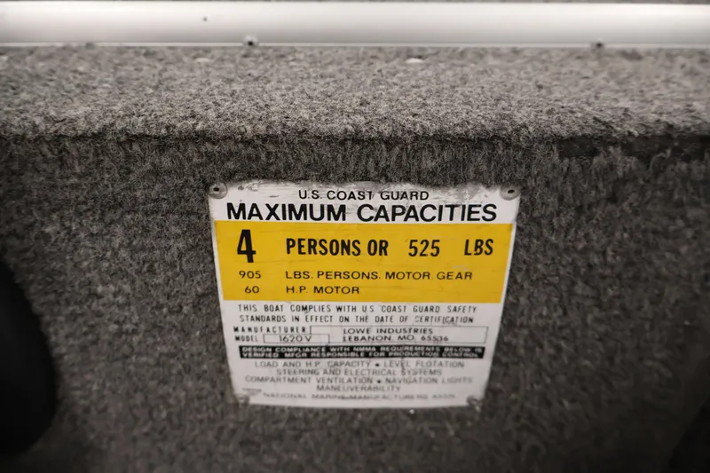 Slide: The Image of U.S. Coast Guard capacity label on 1990 Lowe 1620V boat, maximum 4 persons or 525 lbs. - 28