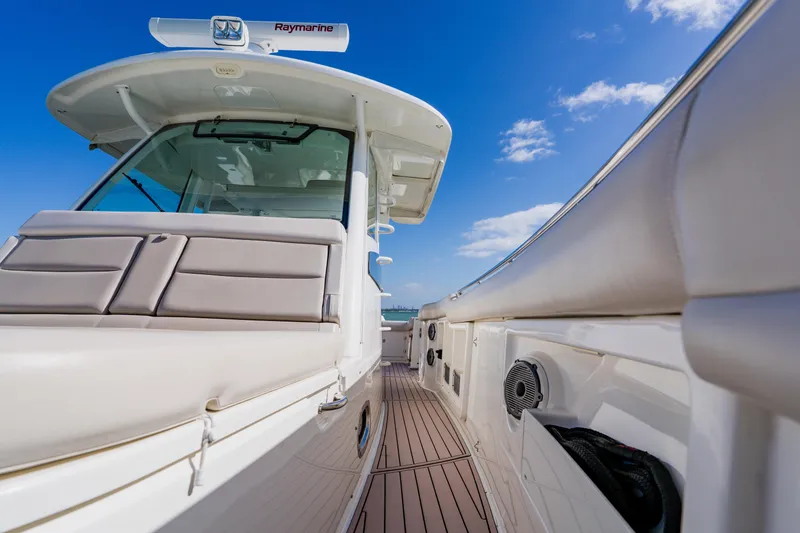 Slide: The Image of 2019 Boston Whaler 380 Outrage boat deck with clear blue sky background. - 17