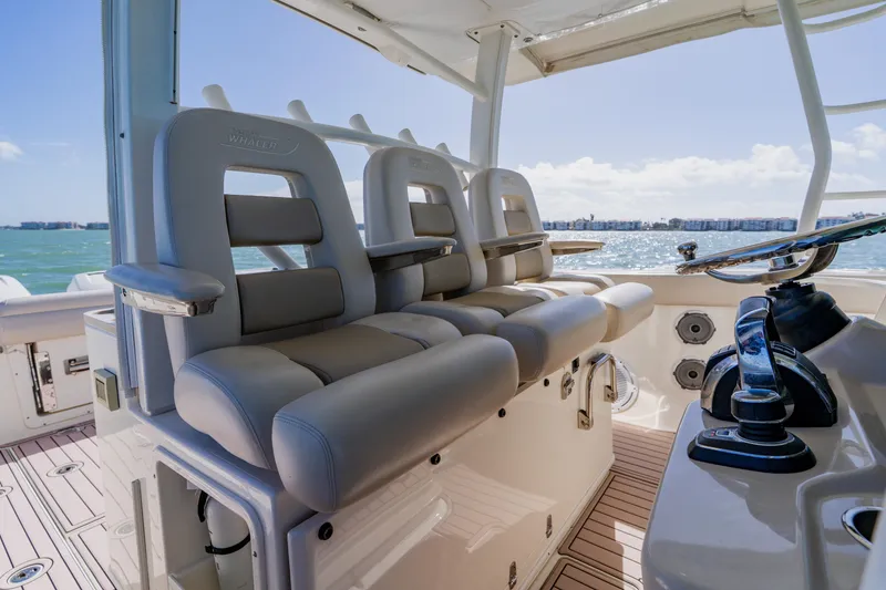 Slide: The Image of 2019 Boston Whaler 380 Outrage helm seating with ocean view. - 20