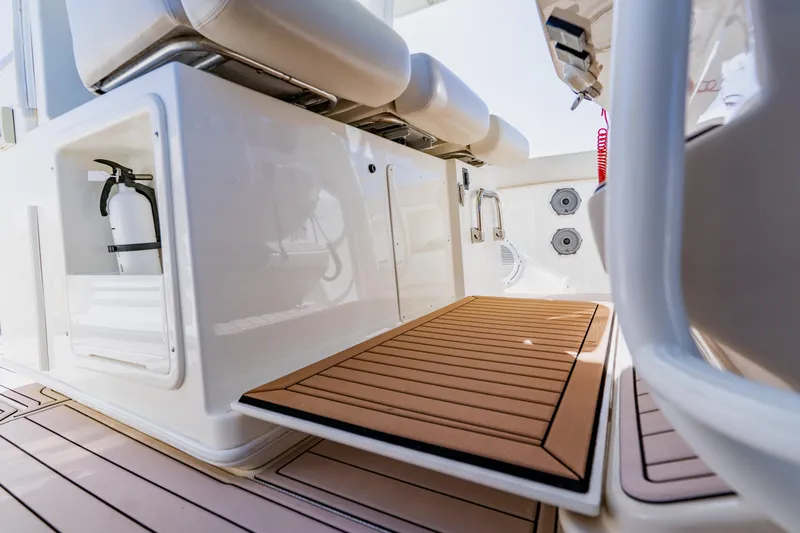 Slide: The Image of 2019 Boston Whaler 380 Outrage interior with seating and safety equipment. - 21
