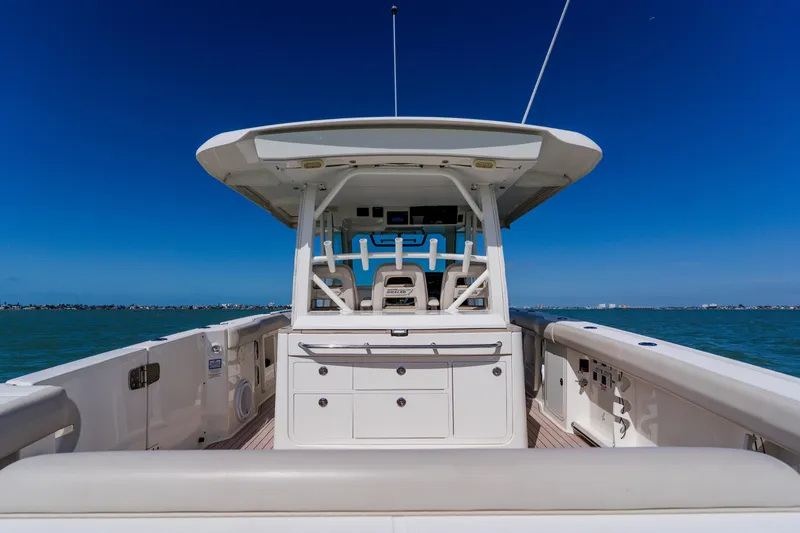 Slide: The Image of 2019 Boston Whaler 380 Outrage boat on open water, clear blue sky. - 25