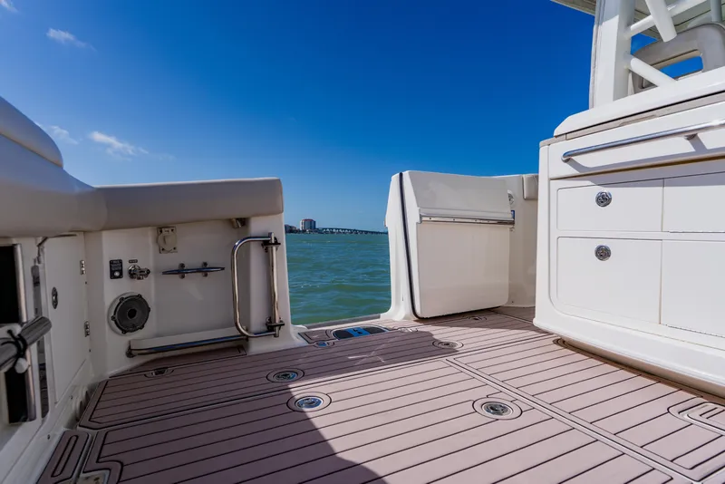 Slide: The Image of 2019 Boston Whaler 380 Outrage boat deck with ocean view and clear blue sky. - 28