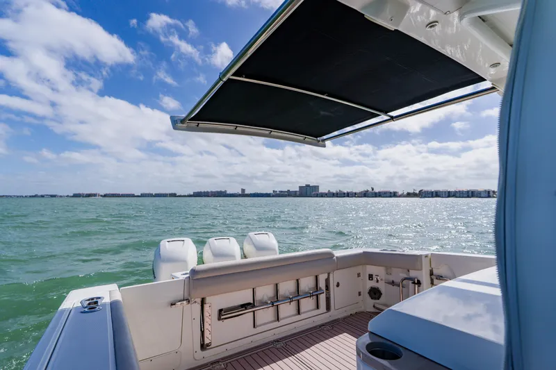 Slide: The Image of 2019 Boston Whaler 380 Outrage boat with ocean view and retractable sunshade. - 31