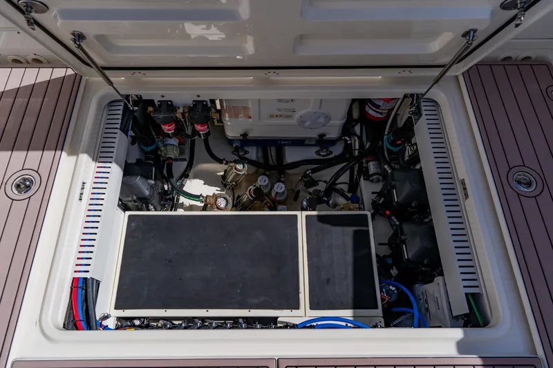 Slide: The Image of 2019 Boston Whaler 380 Outrage engine compartment, showcasing detailed mechanical components. - 37