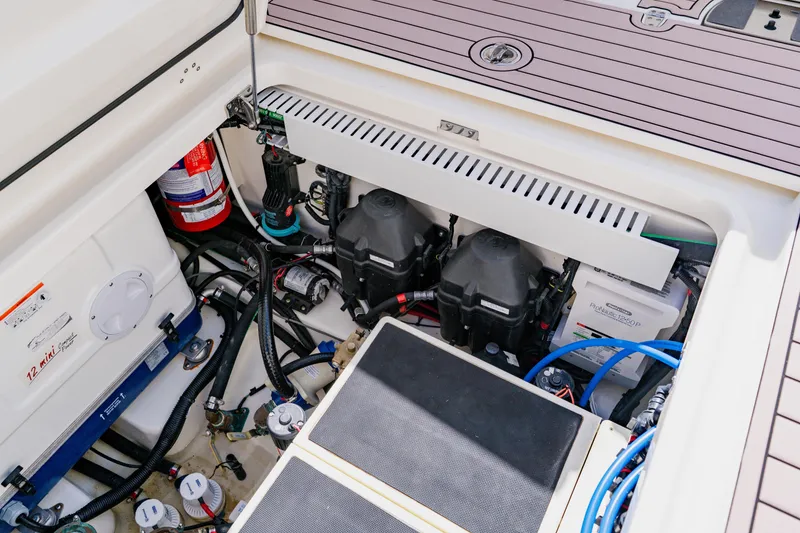 Slide: The Image of Engine compartment of 2019 Boston Whaler 380 Outrage, showcasing wiring and components. - 40