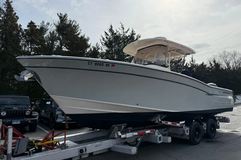 The Image of 2019 Grady-White Canyon 306 boat on trailer, parked outdoors. - 1