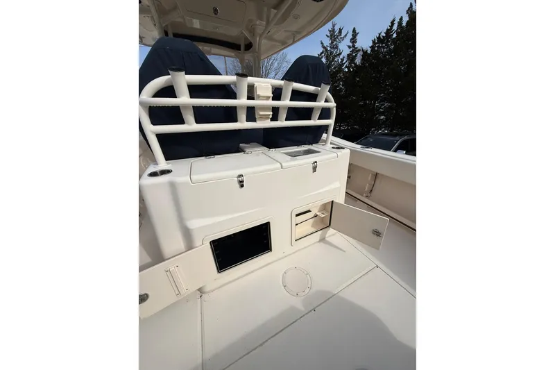 Slide: The Image of 2019 Grady-White Canyon 306 boat interior with storage compartments and seating. - 10