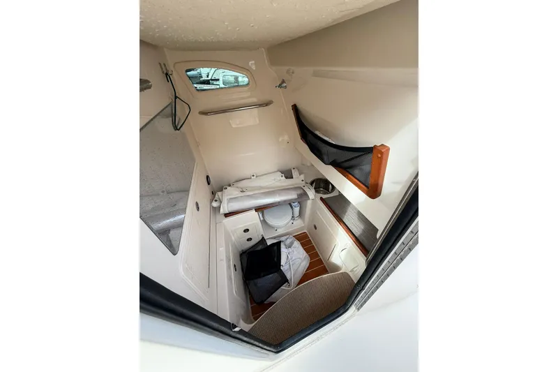 Slide: The Image of 2019 Grady-White Canyon 306 cabin interior with storage and seating. - 17