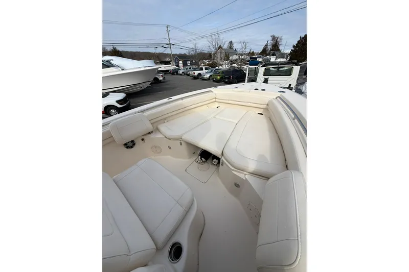 Slide: The Image of 2019 Grady-White Canyon 306 boat interior with white seating and spacious layout. - 18