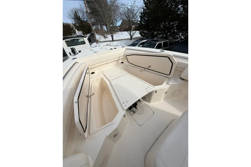 Slide: The Image of 2019 Grady-White Canyon 306 boat interior with open storage compartments. - 20
