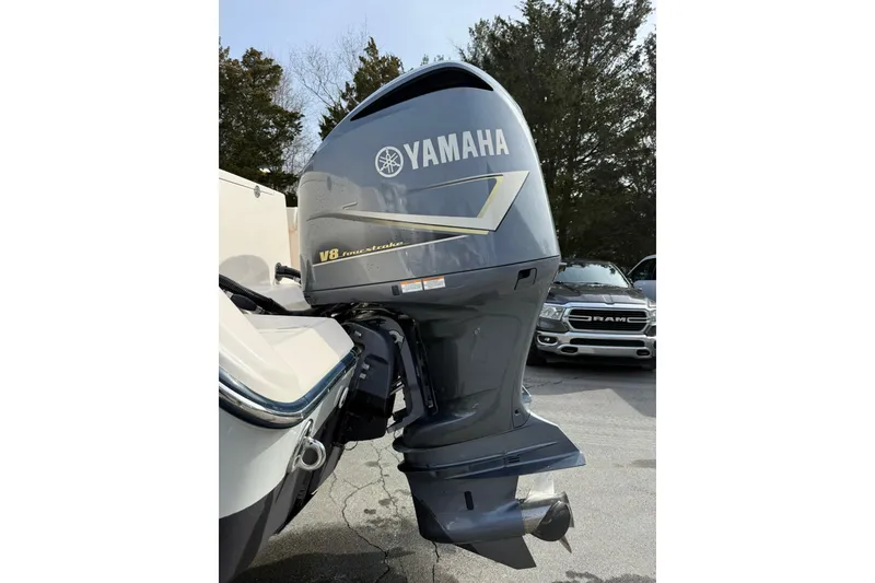 Slide: The Image of 2019 Grady-White Canyon 306 with Yamaha V8 outboard motor, parked outdoors. - 31