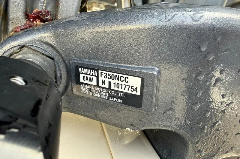 Slide: The Image of Yamaha F350NCC engine label on 2019 Grady-White Canyon 306 boat, wet surface. - 5