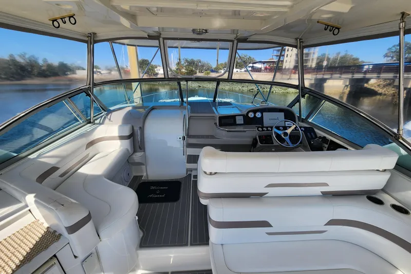 Slide: The Image of 2000 Formula 41 Performance Cruiser docked, featuring sleek design and branding. - 13